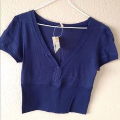 Free People Size S Cotton Blue Short Sleeve Boho Crop Top. V-Neck With Buttons. Pullover Accessories Are Not Included, But Please Visit My Store To View Necklaces Available Approximate Measurements Laying Flat/ Unstretched: Bust (Underarm To Underarm) 14.5" Length (Shoulder To Bottom Hem) 17" Bundle And Save! Casual V-neck Cotton Crop Top, Blue Bohemian Short Sleeve Tops, Casual Blue V-neck Top, Casual Blue V-neck Crop Top, Trendy Navy V-neck Top, Blue V-neck Hippie Top, Free People Short Sleeve Top, Blue Bohemian V-neck Tops, Blue Stretch V-neck Top