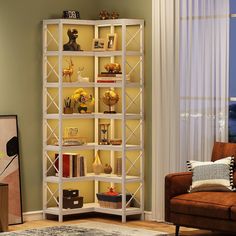 a living room with a couch, chair and book shelf in it's corner