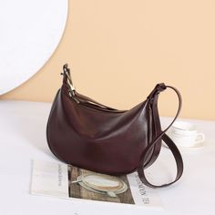 MATERIAL - Made of 100% high quality vegetable-tanned leather, solid color,feels cosy to touch,delicate, durable. The hardware parts are made of cast molding thick hardware, top metal hardware. The stitching is well-made, firm and smooth.DIMENSIONS - 11.4L*3.9W*7.9H(inches) / 29L*10W*20H(cm).STRUCTURE - This shoulder bag contains 1 main compartment, 1 inner slip pocket, 1 inner zipper pocket. Comfortably holds wallet, mobile phone, cosmetics, keys, charge, essentials and so on.FUNCTIONAL - Adjustable shoulder strap, can be crossbody bag, shoulder bag, handbag.OCCASION - The women's real leather crossbody purse made by professional artisans, appearance concise, elegant. Perfect for dating, shopping, working, traveling, vocation, party and other occasions and keep your daily items well organ Elegant Purse, Real Leather Handbags, Everyday Purse, Brown Purse, Coffee Color, Chic Leather, Leather Shoulder Handbags, Brown Purses, Leather Crossbody Purse