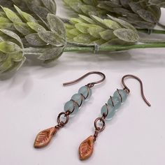 Beautifully Made Sea Foam Blue Czech Glass Bead And Copper Colored Tiny Leaf Charm Create These Unique Pieces. Lightweight And Lead And Nickel Free . Copper Ear Wires . Handmade Ship In Beautiful Gift Box Make A Great Addition To Any Collection Easy Wear Everyday Earring 1.5 Inch Drop Copper Fall, Czech Glass Jewelry, Fall Earrings, Leaf Charms, Ear Wires, Everyday Earrings, Copper Color, Sea Foam, Beautiful Gift Boxes