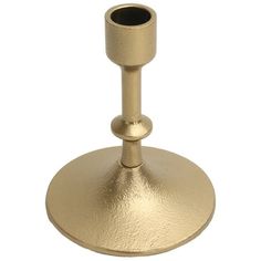 a gold colored candle holder on a white background with no one around it to see in the photo