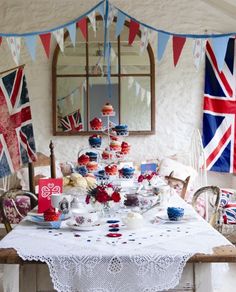 a dining room table covered in british flags