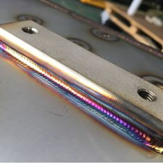 a metal object with multiple colored lines on it