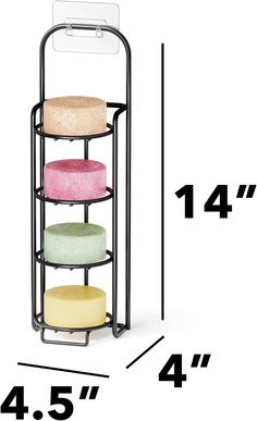 the four tiered rack holds three different colored donuts