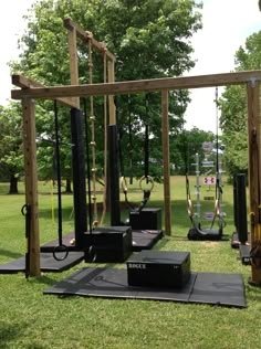 an outdoor gym is set up in the grass