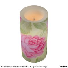 a pink flower candle is lit on a white background