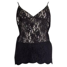 100% authentic Saint Laurent camisole top in sheer black lace (silk 100%). Has adjustable spaghetti straps. Has been worn and is in excellent condition. Measurements Tag Size Missing Tag (M/L) Size M Bust To 90cm (35.1in) Waist To 90cm (35.1in) Hips To 100cm (39in) Length 60cm (23.4in) Side Seam Length 37cm (14.4in) All our listings include only the listed item unless otherwise specified in the description above. Lace Silk, Silk Lace, Lace Camisole, Tank Top Camisole, Helmut Lang, Black Silk, Cami Tops, Halter Top, Tank Top Shirt