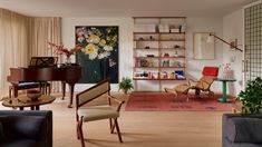 a living room filled with furniture and a piano