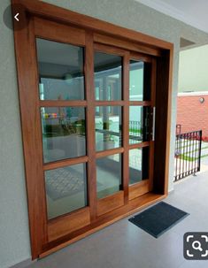 an open wooden door on the side of a building