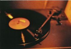 an old record player with a candle on it