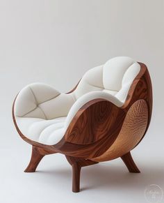 a wooden chair with white upholstered cushions