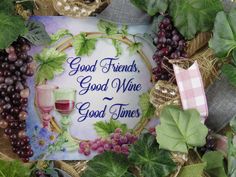 a wreath with grapes, leaves and wine glasses on it that says good friends, good wine good times