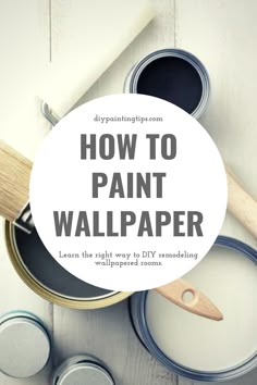 some paint cans with the words how to paint wallpaper