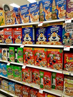 cereal boxes are on display in a store