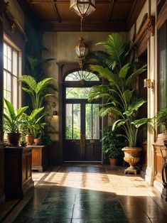 an elegant entry way with potted plants on either side of the door and large windows