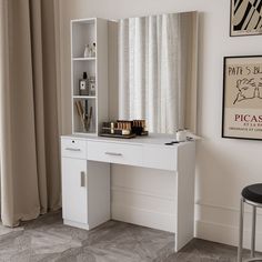 a white desk with a mirror and some books