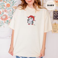 Product Description: Embroidered Winnie The Pooh Honey T-Shirt, Bear Shirt, Pooh Shirt, Gift for Birthday Shirt Introducing our embroidered T-shirts a perfect addition to your wardrobe for those looking for comfortable and stylish clothing options. Made from a blend of 100% ring-spun cotton, these garments offer a cozy feel while maintaining durability. Highlights: - Brand: Comfort Color - Crafted with a medium-heavy fabric (6.1 oz./yd²) - Relaxed fit for added comfort - Signature twill label Be Pooh Shirt, Winnie The Pooh Honey, Cute Penguin, Xmas Lights, Merry Christmas Shirts, Bear Shirt, Color Crafts, Christmas Penguin, Cute Penguins