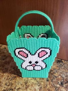 a green basket with an image of a bunny on it