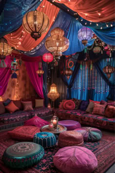 a living room filled with lots of colorful furniture and lights hanging from the ceiling above it