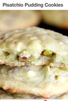 a stack of cookies sitting on top of a cooling rack with pistachios