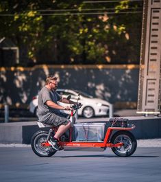 a man is riding an electric scooter