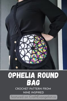 a woman wearing a black dress and holding a crochet bag with the words, ophelia round bag written on it