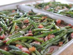 two pans filled with green beans covered in bacon