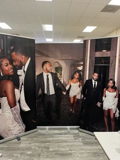 two large pictures of men and women in formal wear are on display at an event