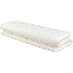 two white mattresses sitting on top of each other