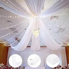 the ceiling is decorated with white drapes and lights