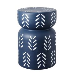 two blue candles with white designs on them