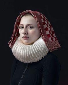 a woman with a scarf on her head and a neck piece wrapped around her face