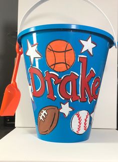 a bucket with some sports related items on it