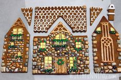 three gingerbread houses are decorated with christmas decorations