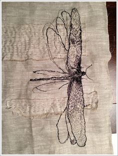 a drawing of a dragonfly on a piece of paper