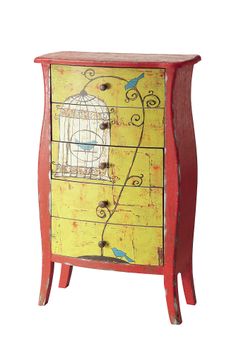 a birdcage painted on an old dresser