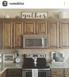 a kitchen with wooden cabinets and stainless steel appliances