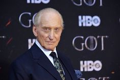 an older man in a suit and tie at the game of thrones season 3 premiere