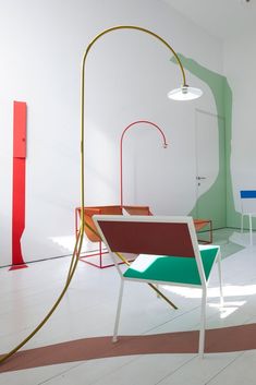 a room with various colored chairs and tables