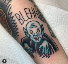 a man with a tattoo on his arm that says blephar and has an image of a demon