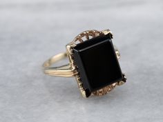 "Sophisticated and yet lovely, this is crafted of sturdy 14 karat gold, with a sweetly scalloped setting. The center is a perfectly polished rectangle cushion of deep black onyx. The smooth style, picture corner prongs, and subtle details of this vintage ring make it appropriate for everyday wear. Metal: 14K Yellow Gold Gem: Black Onyx Gem Measurements: 12.0 x 9.7 mm, Rectangle Ring Size: 5.75 Marks: \"MEXI\" Stamped on the inside band SKU #: P45N504P Each piece has been identified and graded by Elegant Black Onyx Signet Ring, Formal Black Onyx Ring, Black Art Deco Signet Ring For Formal Occasion, Picture Corner, Gold Onyx Ring, Vintage Onyx Ring, Rose Cut Diamond Pendant, Ring Black Stone, Dinner Ring