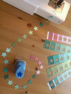 the sewing machine is next to some paper stars