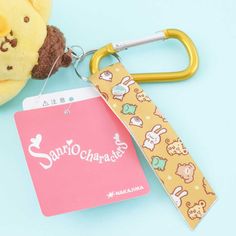 Add a dose of cuteness to your clutch by attaching this mini Pompompurin plushie charm! This fluffy bag accessory has a detachable printed wrist strap which has a metal carabiner attached to it. A kawaii small-sized Pompompurin plushie bag charm Made of super-soft polyester Comes with removable printed wrist strap that has a metal carabiner attached to it Original licensed product from Sanrio Japan Plushie Bag, Fluffy Bag, Sanrio Japan, Wrist Strap, Bag Accessories, Personalized Items, Kawaii