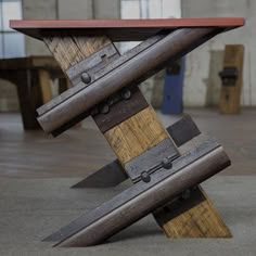 a wooden table with metal straps on it