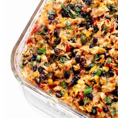 a casserole dish filled with chicken and black beans