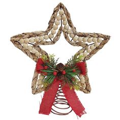 a christmas star decoration with pine cones and berries