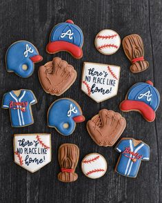 decorated cookies that say there's no place like home and baseball hats on them