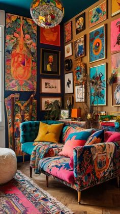 a living room filled with lots of colorful art on the walls and furniture in front of a window