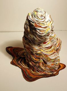 a stack of folded papers sitting on top of a table