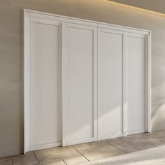 an empty room with white doors and tile flooring on the wall, in front of a large window